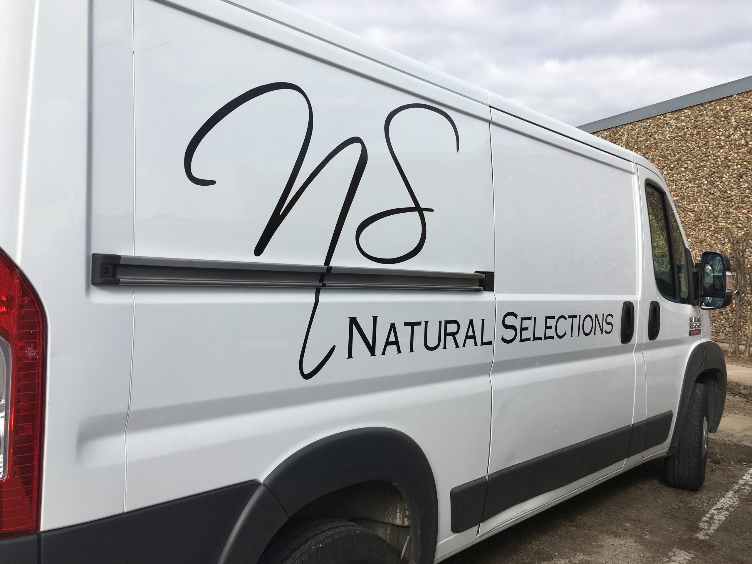 Black vinyl logo on a van